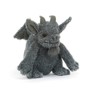 A gray plush gargoyle toy with large pointed ears, fangs, small horns, and a stitched smiling face with a gray beard. The plush is shown against a white background.