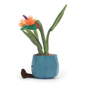 adorably soft plushie of a smiling flower pot with birds of paradise sprouting by popular brand Jellycat.
