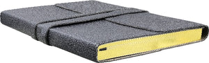 black textured book with a gold guilded page edges 
