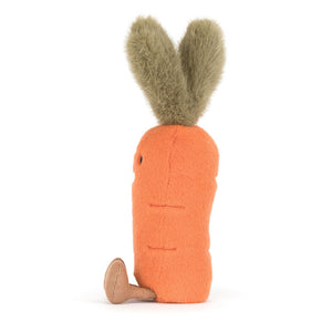 Side view of a Jellycat orange carrot shaped plush with a green stem and brown feet on a white background.
