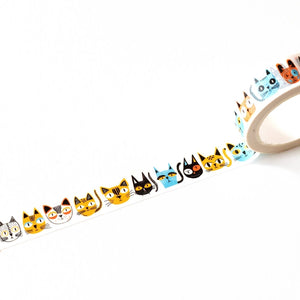 A roll of washi tape featuring a repeating pattern of colourful, illustrated cat faces in various colors, shown partially unrolled on a clean white background.