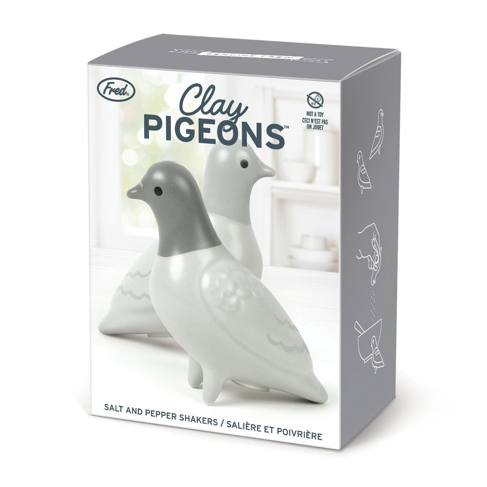 Image of a packaging box for a pigeon-themed salt and pepper shaker set. The box shows an image of the products with the text 'Clay Pigeons' and the company branding.