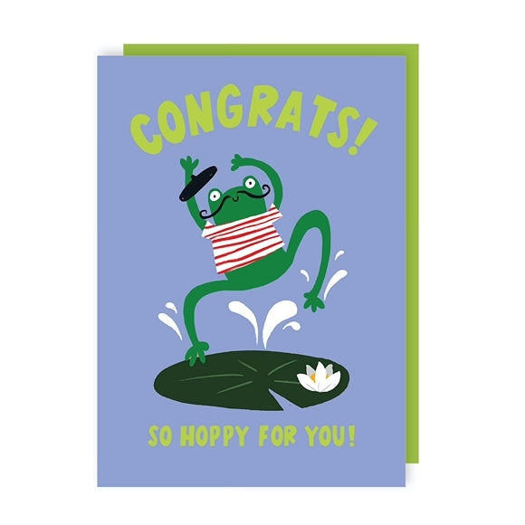 Greeting card with an illustration of a French frog wearing a mustache, beret and striped shirt jumping on a lily pad with the text 'Congrats! So Hoppy For You!' on a blue background.