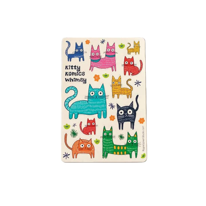 A rectangular sticker sheet featuring playful illustrated images of colourful cats. The text 'Kitty Komics Whimsy' is printed at the top. 