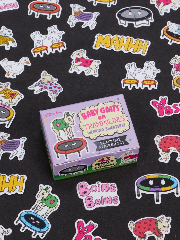 Image showing a packaging box for a 'Baby Goats On Trampolines Wearing Sweaters' themed sticker set. Goat-themed stickers surround the box. The box and stickers sit against a black surface.