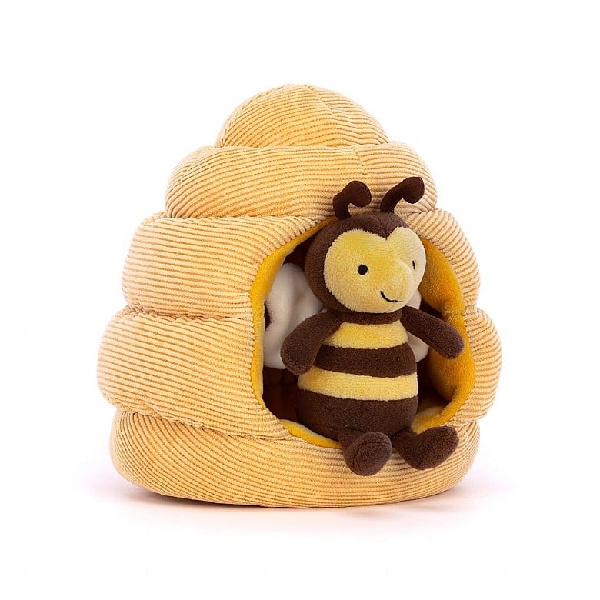 adorably soft plushie of a smiling bee in a beehive by popular brand Jellycat.
