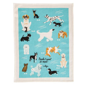 Image of a blue kitchen cloth with playful dog illustrtions and the text 'People I Want To Meet: 1. Dogs'.