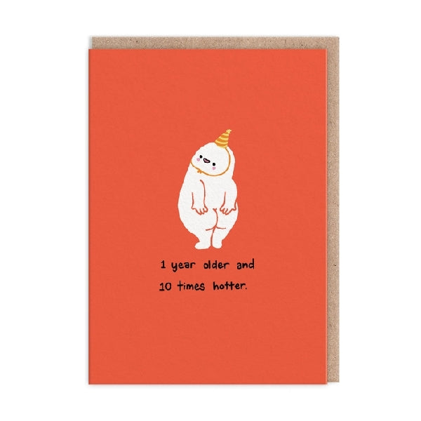 Greeting card with an illustration of a white character wearing a party hat and showing it's butt on an orange background, with the text '1 Year Older and 10 Times Hotter'.