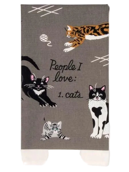 A folded grey kitchen cloth with cat illustrations and the text 'People I Love: 1. Cats'.