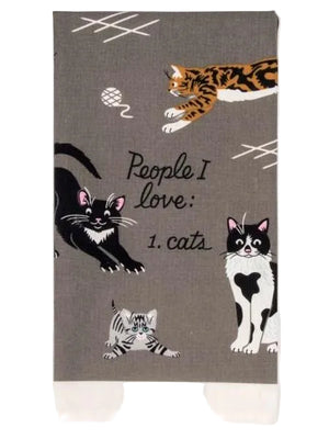 A folded grey kitchen cloth with cat illustrations and the text 'People I Love: 1. Cats'.