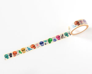 A roll of washi tape featuring a repeating pattern of colourful skull illustrations in various colors, shown partially unrolled on a clean white background.