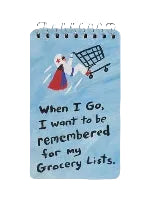 A spiral-bound notebook with a light blue cover featuring an illustration of a figure wearing a cape pushing a grocery cart and the text, 'When I Go, I want to be remembered for my Grocery Lists.'.
