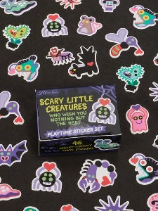 Image showing a packaging box for a Scary Little Creatures themed sticker set. Stickers of colourful spooky creatures surround the box. The box and stickers sit against a black surface.