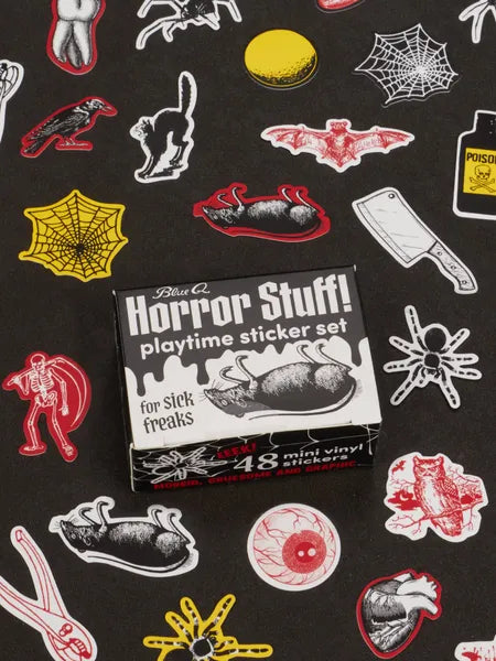 Image showing a packaging box for a 'Horror Stuff!' themed sticker set. Horror-themed stickers such as eyeballs, dead animals and bugs surround the box. The box and stickers sit against a black surface.