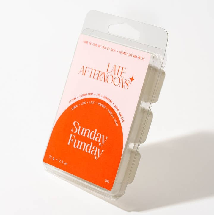 A packaged wax melt product with a label that shows the brand name and the text 'Sunday Funday' with a bright orange and baby pink color scheme. The package sits on a white background. 