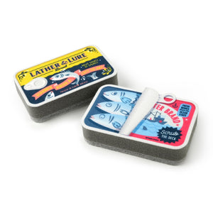 Image of two kitchen sponges that are designd to look like cans of sardines on a white background. 