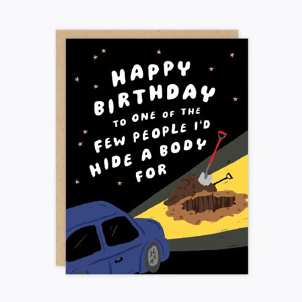 black birthday card with a blue car flashing its lights on a small digging patch. text reads "happy birthday to one of the few people i'd hide a body for"