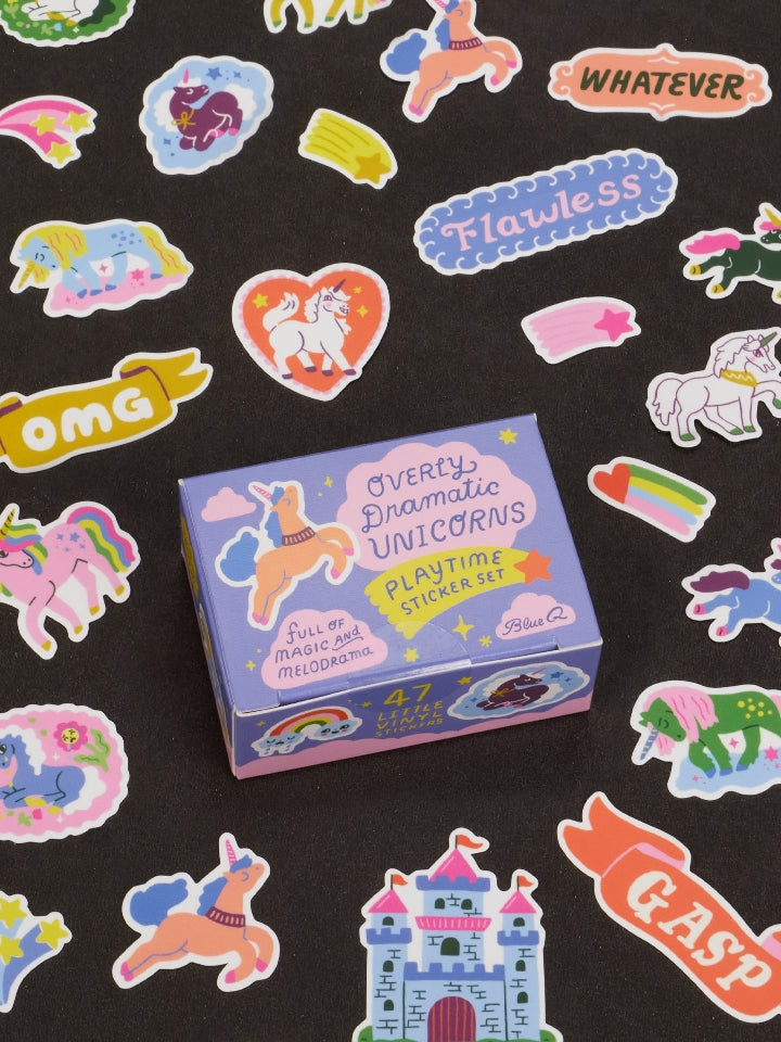 Image showing a packaging box for an 'Overly Dramatic Unicorns' themed sticker set. Unicorn-themed stickers surround the box. The box and stickers sit against a black surface.