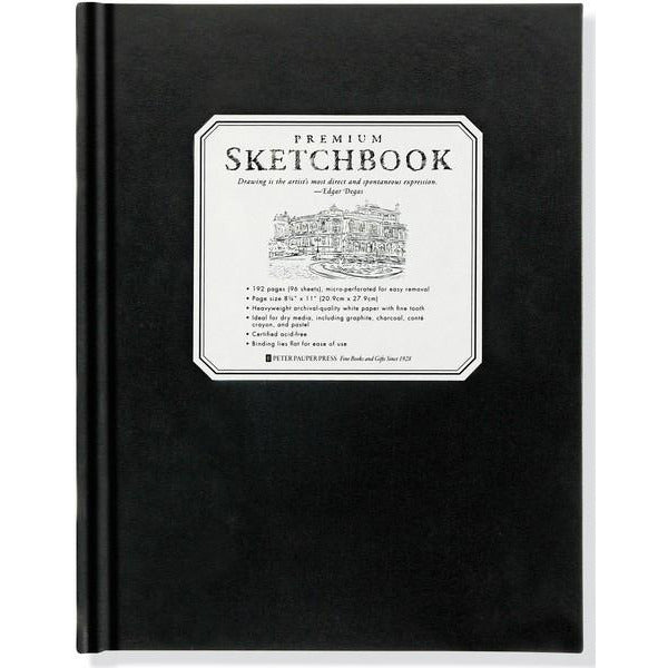 black sketchbook with a white sticker detailing the specifications of the "prenium sketchbook" 