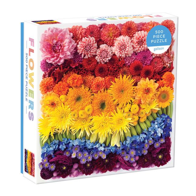 white puzzle box. the cover shows countless flowers organized in the order of the rainbow (red at the top, indigo and purple at the bottom)