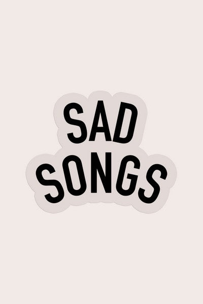 white die-cut sticker of the text "sad songs"